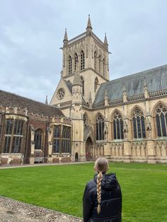 a person standing in front of a large building