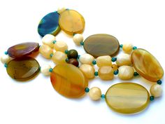 Statement Gemstone Jewelry - This is a substantial green & yellow agate and yellow quartz bead necklace. It is hallmarked 925, has sterling silver clasp and extension, chain, widest bead is 1.25" wide. It is 30" long, which includes the 2" extension, so it can be worn from 28" to 30" in length. Weight is 189 grams.