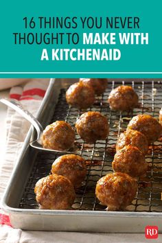 a pan filled with meatballs on top of a metal rack