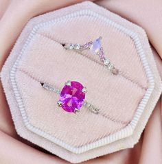 Sensibly-priced, Hypoallergenic 925 Silver gemstone rings, created with luxury and quality in mind.  Our classic pink sapphire ring set has the perfect 3 shades of pink - it has milky pink nanosital and light pink spinel stones on the stacking band and our pink sapphire 💕 if you are a obsessed with pink, this will truly make your heart skip a beat!!  Specifications: Gemstone: Pink Sapphire  Size and Shape:  7x9mm Oval Complementary Stones: White Zircon Stacking Ring Stones: White Zircon, pink s Pink Sterling Silver Diamond Ring With Accent Stones, Pink Sapphire Birthstone Ring With Gemstone, Pink Gemstone Birthstone Ring With Round Cut, Pink Sapphire Promise Ring With Vvs Clarity, Pink Round Cut Birthstone Ring With Gemstone, Pink Gemstone Birthstone Ring, Pink Round Cut Birthstone Ring, Pink Amethyst Ring With Pink Sapphire And Accent Stones, Pink Sapphire Gemstone Rings