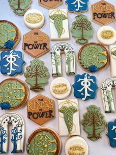 the cookies are decorated with different types of trees and letters on them, all in various colors