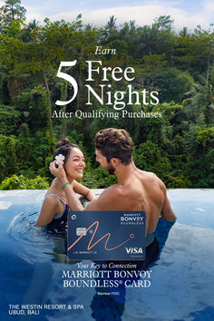 a man and woman are in the water with head phones to their ears while holding a sign that says 5 free nights after quliying purchases