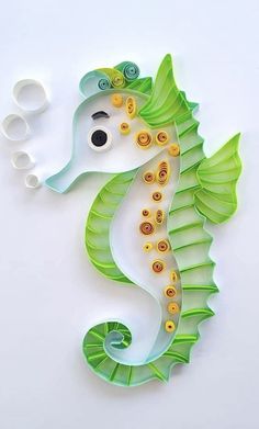 a sea horse made out of paper and scissors