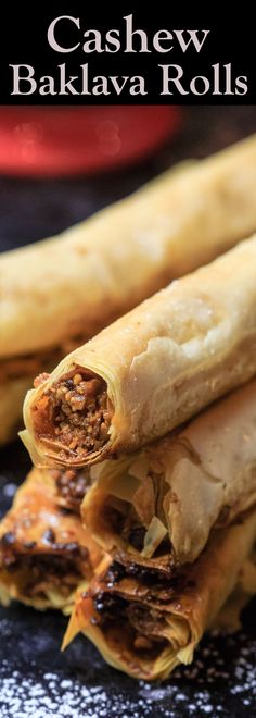 some food is stacked on top of each other with the words cashew bakalava rolls