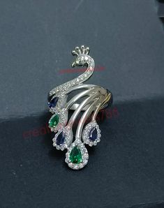 We Ship Worldwide. (All type of customization done here - custom Order takes extra 3-5 days to make order jewelry) Title : Peacock Bird Ring Crystal Anniversary Eternity Emerald Sapphire Cubic Zirconia Wedding Cocktail, 925 Silver, Fashion Jewelry For Women Girl - Handmade Product - Base Metal: Sterling Silver - Metal Purity: 925 - Finish: 14K White Gold Plated - Style: Peacock Bird Ring  - Main Stone Clarity: VVS1 / D - Main Stone: Sapphire  - Main Stone Creation: Simulated  - Stone Color: Blue Luxury Peacock Design Jewelry For Anniversary, Unique Peacock Design Wedding Jewelry, Peacock Finger Ring, Ornate Silver Jewelry With Peacock Design, Silver Peacock Ring, Peacock Ring, Bird Ring, Bird Rings, Peacock Bird