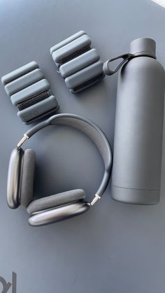 an image of headphones and water bottle on the table