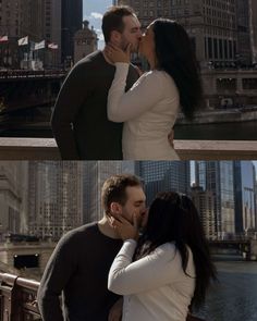 a man and woman kissing in front of a city skyline