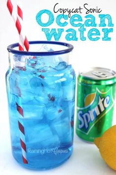 an ocean water drink in a mason jar next to lemons and a can of soda