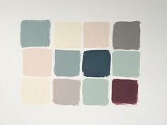 a white wall with many different shades of paint