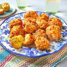 some fried food is on a blue and white plate