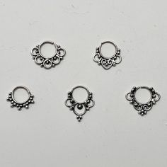 "These are so pretty and light. Made is 925 sterling silver with tribal details. The rings are all 10mm (1cm or .40\") in diameter. The wire is 18 gauge. They are only finished on one side since each one is made BY HAND so there may be very slight differences. One of the images contains numbers to specify which you would like from the drop down menu." Nickel-free Small Hoop Sterling Silver Septum Ring, Nickel-free Sterling Silver Round Nose Rings, Bohemian Nickel-free Septum Ring, Nickel-free Silver Metal Septum Ring, Bohemian Silver Nickel-free Septum Ring, Nose Rings Studs, Seed Of Life, Nose Rings, Nose Ring Stud