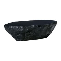 a large black stone table on a white background with the top half covered in dark fabric