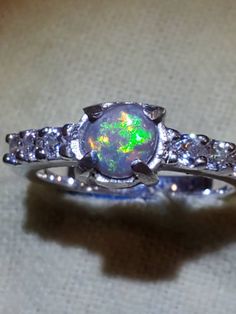 Ring I bought at a flee market and put a new stone into, 1.5 carat lightning ridge stone with a nice green flash,silver ring. My vintage rings go quick Opal Engagement Ring Vintage, Opal Ring Engagement, Vintage Opal Ring, Vintage Opal Engagement Ring, Opal Ring Vintage, Australian Opal Ring, Black Opal Ring, Opal Wedding Rings, Opal Wedding