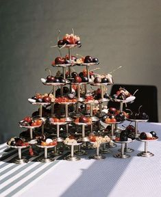 a table topped with lots of different types of desserts