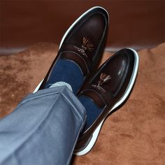 Designed for the refined gentleman, these slip-on dress shoes combine the luxury of cow leather with the practicality of a pigskin lining, offering both comfort and style. Luxury Brown Tassel Loafers For Business, Luxury Brown Tassel Loafers For Semi-formal Occasions, Luxury Brown Tassel Loafers For Semi-formal, Formal Brown Slip-on Shoes, Brown Formal Slip-ons, Formal Brown Slip-ons, Brown Monk Strap Shoes For Business Casual, Business Brown Slip-ons With Leather Lining, Masculine Brown Slip-on Leather Shoes