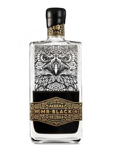 a bottle of alcohol with an owl on it