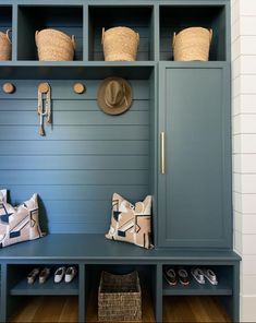 a blue bench with baskets and hats on it