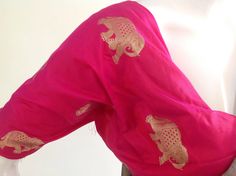 "Gorgeous royal blue and pink semi silk saree with intricate elephant hand embroidery and silk brocade unstiched blouse in pink with matching elephant weave. The hot pink color of the blouse is simply stunning when paired with royal blue of the saree. Beautiful elephant zardosi work makes this a stunning piece. Saree length 5.5 meters Blouse fabric 1 meter 44\" wide Saree ships in 2-3 days of payment.Shipping time is 4-5 days with tracking. We also offer blouse and petticoat stitching for saree Pink Blouse Piece With Motifs For Diwali, Pink Katan Silk Blouse Piece With Motifs, Pink Chanderi Blouse Piece With Motifs, Pink Raw Silk Traditional Wear With Motifs, Pink Unstitched Blouse Piece With Motifs, Pink Paithani Silk Traditional Wear With Resham Embroidery, Pink Motif Raw Silk Traditional Wear, Unstitched Pink Blouse Piece With Motifs, Pink Raw Silk Saree With Motifs