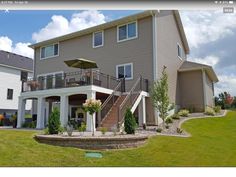 a large house with stairs leading up to it