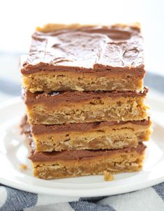 three pieces of cake sitting on top of a white plate