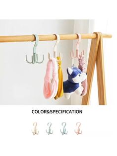 three pairs of hooks hanging from a wooden rack