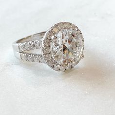 Made Size 7 But I Can Make In Another In Your Size. 6ct Jewel Eternal Center Moissanite Gem Surrounded By A Halo Of .20ct Moissanites. All D, Vvs1 Quality To Match A Diamond If Side By Side. Pave On The Split Shank Band. 925 Sterling Silver With Rhodium Platinum Over It. Solid Gold Upon Request. Solid Platinum Upon Request. Last Pic Is Charles & Covard Smaller Ct Size For More Money$. I Guarantee Mine To Be Equal Or Better Quality Than C&C. Comes With Gemologist Report. Timeless White Jewelry With Vs Clarity, White Halo Ring Radiant Cut For Anniversary, White Radiant Cut Halo Ring For Anniversary, Timeless Halo Ring With Brilliant Cut Moissanite, Timeless White Topaz White Rings, Timeless White Rings With Vs Clarity, White Moissanite Halo Ring With Brilliant Cut, White Radiant Cut Wedding Ring With Halo Setting, Timeless White Moissanite Jewelry