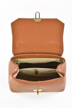 Elegant Cognac Bag For On-the-go, Elegant Crossbody Leather Backpack For Travel, Elegant Leather Crossbody Backpack For Travel, Elegant Bags With Leather Lining For On-the-go, Gold-tone Hardware Box Shoulder Bag For Travel, Top Handle Flap Bag With Leather Lining For Travel, Luxury Clutch Bags With Zipper Closure, Elegant Cognac Shoulder Bag For On-the-go, Luxury Leather Lined Saddle Bag For Travel