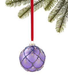 a purple ornament hanging from a christmas tree