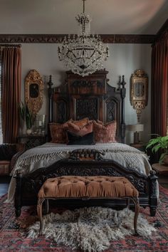 a bedroom with a chandelier hanging from the ceiling and an ornate bed frame