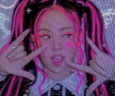 a girl with pink hair is holding her hands in front of her face