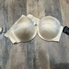 Nwt Never Worn Strapless Enhanced Lift Beige / Tan / Nude Color Comes With Straps Seperate Beige Stretch Shapewear Bra, Cream Push-up Bra With Built-in Support, Beige Push-up Bra With Removable Pads, Beige Stretch Underwire Bra, Beige Stretch Push-up Bra, Beige Push-up Bra, Fitted Beige Shapewear Bra, Beige Fitted Shapewear Bra, Beige Push-up Bra With Lined Body