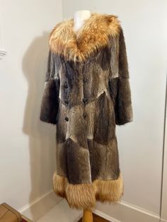 Vintage 1970s Mixed Fur Coat Description: Stunning 'Penny Lane' style mixed fur coat from the 70s. Soft short brown fur for the bodice of the coat, and collar is a structured long haired fur.  Custom made in Edmonton by 'Furs by Lister' with immaculate lining. Double breasted with all its original buttons and button loops.  Size: Size is unmarked, but closest to women's 4 or 6 US.  Condition: Very good with light wear. Perfect lining. One light spot of wear on fur at the back of left elbow. Not Retro Fitted Brown Fur Coat, 1970s Fur Coat, Vintage Beige Fur Coat, Vintage Brown Fur Coat With Pockets, Vintage Brown Faux Fur Outerwear, Brown Fur, Penny Lane, Soft Shorts, Vintage 1970s