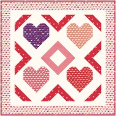 a quilt with hearts on it in red, white and blue