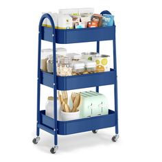 a blue cart filled with food on top of a white background and lots of other items