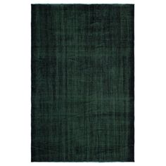 a dark green rug on a white background