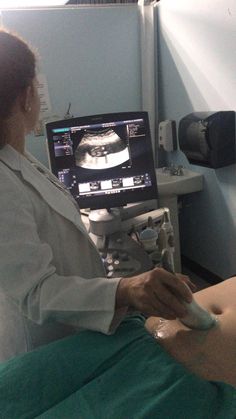 a woman is in the operating room with an x - ray