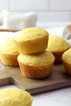 several yellow muffins stacked on top of each other