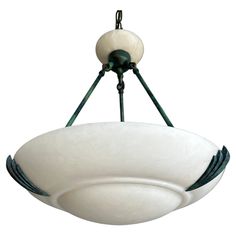 a light fixture hanging from the ceiling with two lights on each side and an oval glass shade