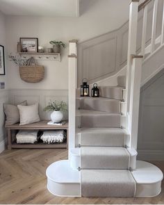 the stairs in this house are made of wood and have been painted gray with white trim