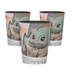 the child yoda from star wars is shown on two cups