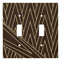 an art deco light switch plate cover in black and gold