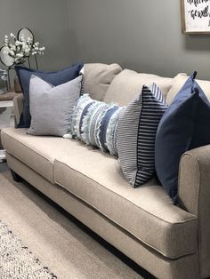 a couch with several pillows on top of it