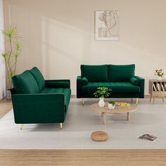 a living room with green couches and chairs