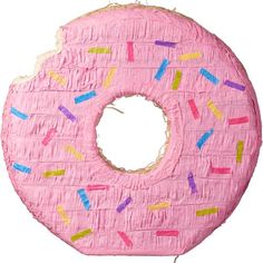 a pink doughnut with sprinkles is hanging from a string on a white background