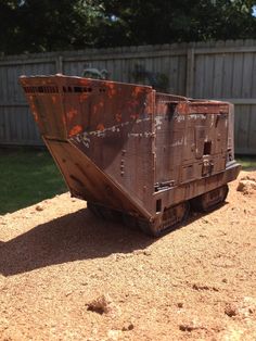 an old rusty dump truck sitting in the dirt