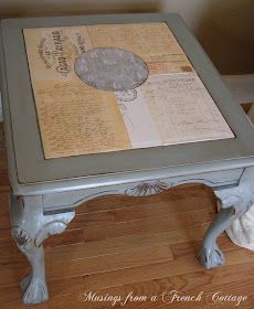 an old table has been transformed into a coffee table with writing on the top and bottom