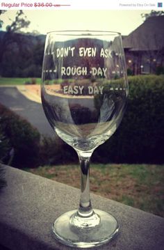 a wine glass that says i don't even ask rough day, easy day