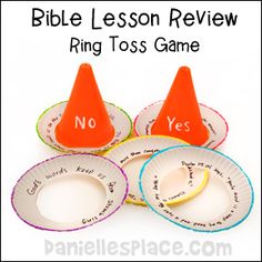 three paper plates with orange cones on them and the words ring toss game next to each other