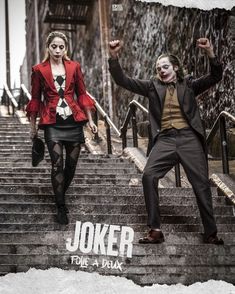 a man and woman dressed up as joker and the girl in red is walking down some stairs