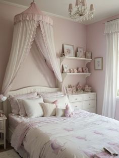 a bedroom with pink walls, white furniture and a canopy bed in the middle of it